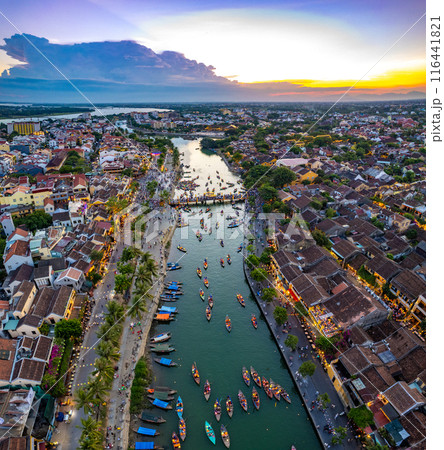 Aerial view of Hoi An Ancient Town with lantern boats on Hoai river, in Hoi An, Vietnam Aerial view of Hoi An Ancient Town with lantern boats on Hoai river, in Hoi An, Vietnam 116441821