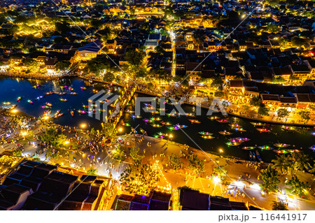Aerial view of Hoi An Ancient Town with lantern boats on Hoai river, in Hoi An, Vietnam 116441917