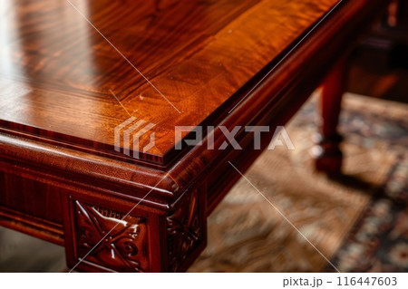 Close-up of a Mahogany Tabletop with Intricate Details 116447603