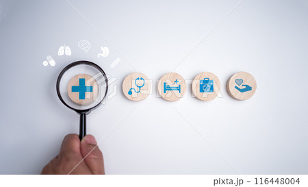 Human hands hold a magnifying glass and focus on the plus sign and healthcare medical icon on white background, Health insurance concept, Health and access to welfare health concept. Human hands hold a magnifying glass and focus on the plus sign and healthcare medical icon on white background, Health insurance concept, Health and access to welfare health concept. 116448004