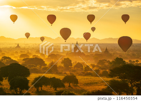 Balloon over plain of Bagan in misty morning, Myanmar Balloon over plain of Bagan in misty morning, Myanmar 116450354