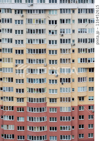 Skyscraper very tall building with many windows in urban area during daytime 116452615