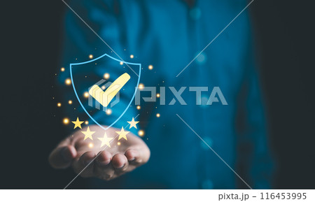 Businessman holding standard quality control certification assurance guarantee for automation process. Quality management with Quality Assurance, Quality Control, Standardization, health insurance, 116453995