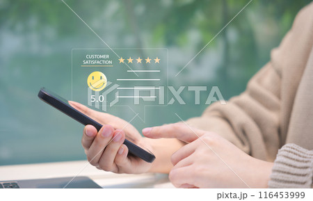 Customer review satisfaction feedback survey concept. Person giving a five-star customer satisfaction rating on a smartphone, implying excellent service quality. User experience online application. Customer review satisfaction feedback survey concept. Person giving a five-star customer satisfaction rating on a smartphone, implying excellent service quality. User experience online application. 116453999