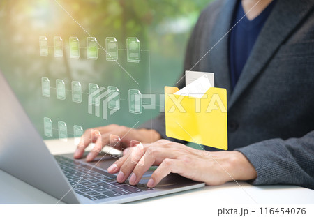 DMS Document management system concept. Businessman using computer to manage document files in folders. folder file storage on cloud. share database online, software for archiving and company data. DMS Document management system concept. Businessman using computer to manage document files in folders. folder file storage on cloud. share database online, software for archiving and company data. 116454076