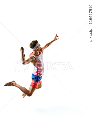 Male tennis athlete in sportswear performing a swing with multicolored paddle, hitting ball, viewed from above isolated on white background Male tennis athlete in sportswear performing a swing with multicolored paddle, hitting ball, viewed from above isolated on white background 116457916