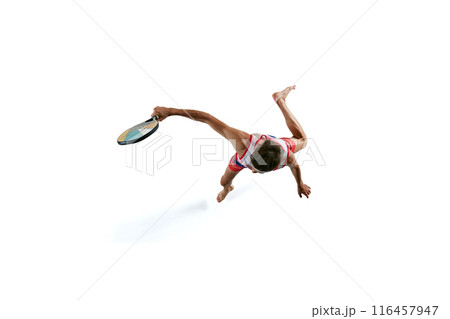 Dynamic isometric view of competitive young man in motion, playing beach tennis isolated on white background 116457947