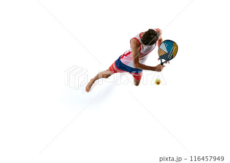 Dynamic isometric view of competitive young man in motion, playing beach tennis isolated on white background 116457949