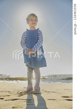 Charming child playing on the beach in Denmark 116461036