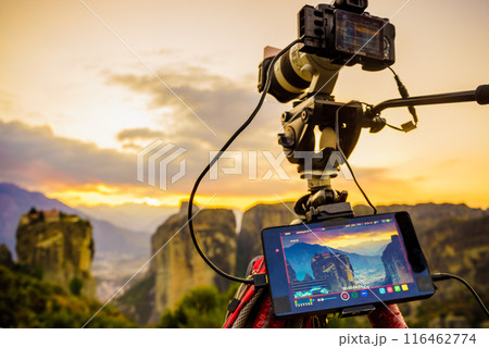 Camera on tripod and Meteora monasteries Camera on tripod and Meteora monasteries 116462774
