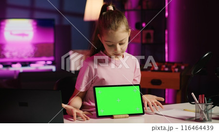 Cute child content creator filming technology review of newly released isolated screen tablet, unpacking it and presenting specifications to audience. Young online star showing mockup device to fans Cute child content creator filming technology review of newly released isolated screen tablet, unpacking it and presenting specifications to audience. Young online star showing mockup device to fans 116464439