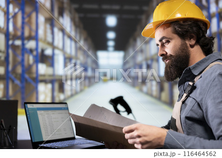 Production supervisor reading order receipts from archived folders, examining manufacturing dispatch notes to help with post service distribution. Stock manager using cargo parcel invoices. 116464562