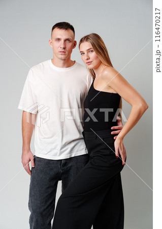 A Man and a Woman Standing Next to Each Other in studio 116470217