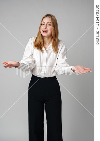 Woman in Formal Suit Holding Out Her Hands 116470300