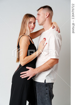A Man and a Woman Standing Next to Each Other in studio 116470722