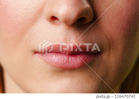 Close-Up of a Womans Lips and Nose With a Neutral Expression Close-Up of a Womans Lips and Nose With a Neutral Expression 116470742