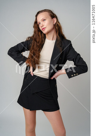 Woman With Long Hair and Blue Eyes on gray background Woman With Long Hair and Blue Eyes on gray background 116471005