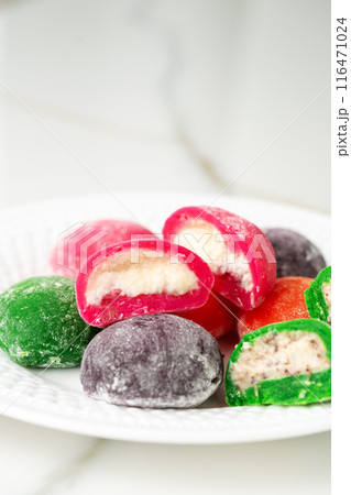 Multi-colored Japanese cakes Mochi in a white plate Multi-colored Japanese cakes Mochi in a white plate 116471024