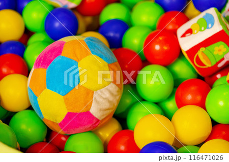 Colorful Soft Ball and Toy Truck in a Pit of Plastic Balls at an Indoor Playground Colorful Soft Ball and Toy Truck in a Pit of Plastic Balls at an Indoor Playground 116471026