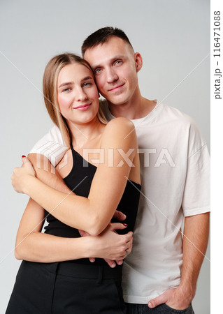 A Man and a Woman Standing Next to Each Other in studio A Man and a Woman Standing Next to Each Other in studio 116471088