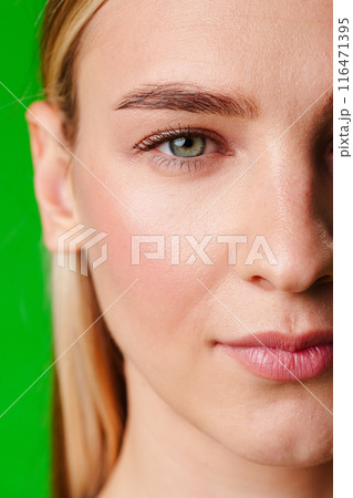 Close Up Portrait of Woman With Green Background Close Up Portrait of Woman With Green Background 116471395