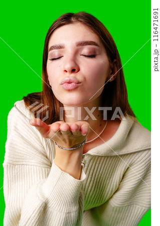 Woman in White Sweater Making Hand Gesture 116471691