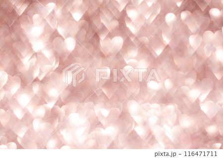 Valentine's Day background made of out-of-focus bokeh in the shape of hearts. Valentine's Day background made of out-of-focus bokeh in the shape of hearts. 116471711