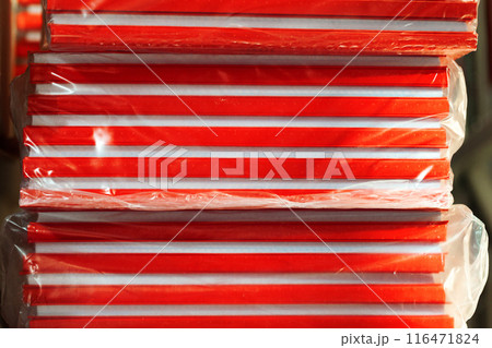 Cardboard sheets pack on a shelf of warehouse Cardboard sheets pack on a shelf of warehouse 116471824