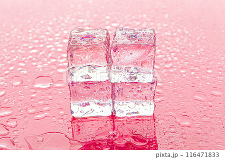 Fozen ice cubes on wet pink background Fozen ice cubes on wet pink background 116471833