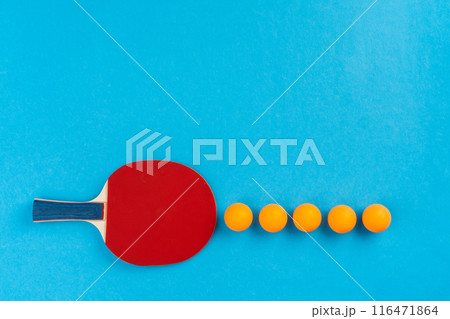 Ping pong racket and ball on blue background Ping pong racket and ball on blue background 116471864