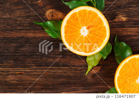 Sliced into pieces juicy ripe oranges close up 116471907
