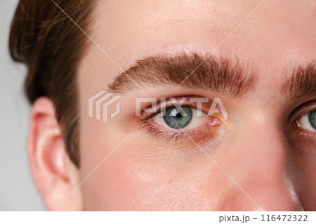 Close Up of a Man With Blue Eyes Close Up of a Man With Blue Eyes 116472322