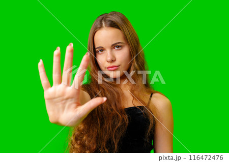 Young Woman Making a Stop Sign Gesture Young Woman Making a Stop Sign Gesture 116472476