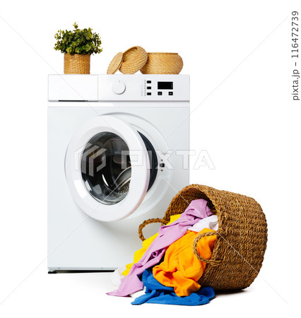 White Washing Machine With Open Door and Clothes Overflowing From a Wicker Basket White Washing Machine With Open Door and Clothes Overflowing From a Wicker Basket 116472739
