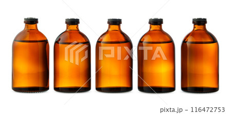Five Amber Glass Bottles With Liquid on White Background 116472753