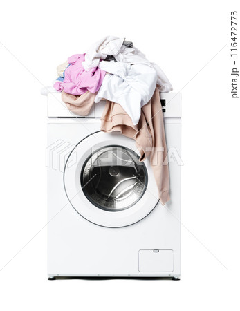White Washing Machine With Pile of Laundry on Top 116472773