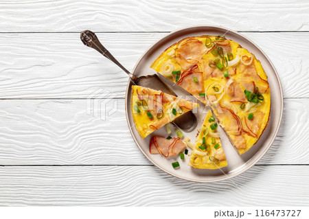 deli ham onion omelette on skillet, top view deli ham onion omelette on skillet, top view 116473727