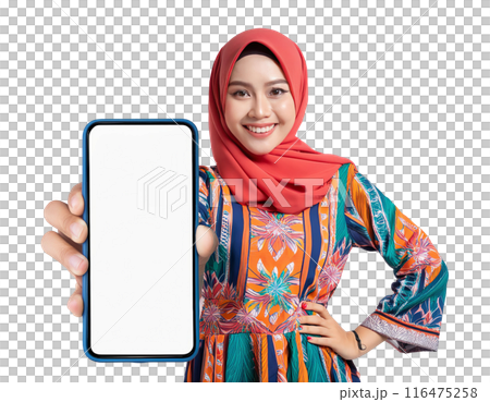 A smiling beautiful young Asian Muslim woman wearing hijab shows huge mobile phone 116475258