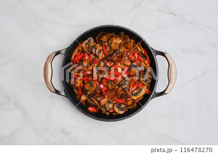 Frying pan with mushrooms, onion and bell pepper on marble background 116478270
