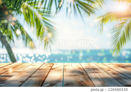Summer table and sea with blurred palm leaves 116480330