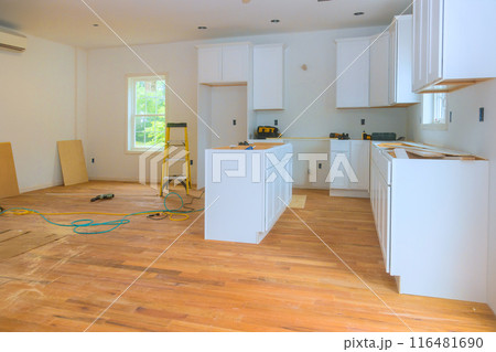 Constructing new custom kitchen cabinet as part of home improvement project 116481690