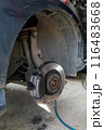 Closeup of steel brake disc in car service. 116483668