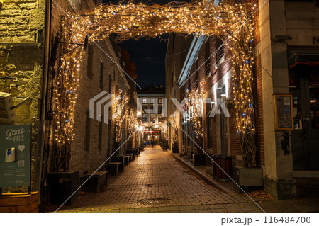 Montreal, Quebec, Canada - October 18 2022 : Saint-Amable Street (Rue Saint-Amable) in Old Montreal at night. 116484700