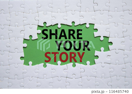 Share your story symbol. White puzzle with words Share your story. Beautiful green background. Business and Share your story concept. Copy space. 116485740