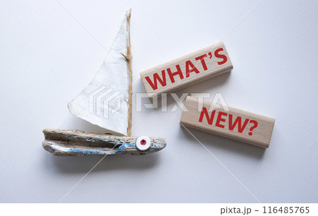 What is new symbol. Concept word What is new on wooden blocks. Beautiful white background with boat. Business and What is new concept. Copy space What is new symbol. Concept word What is new on wooden blocks. Beautiful white background with boat. Business and What is new concept. Copy space 116485765