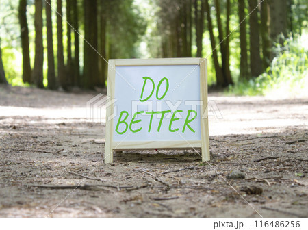 Do Better symbol. Do Better white chalk blackboard. Beautiful forest background. Business and Do Better concept. Copy space. 116486256