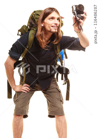 Man tourist backpacker taking photo with camera. Man tourist backpacker taking photo with camera. 116486287