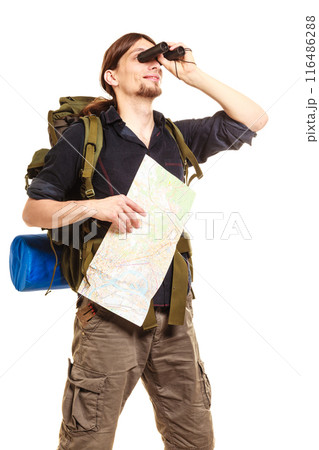 Man backpacker with map looking through binoculars Man backpacker with map looking through binoculars 116486288