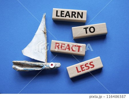 Learn to react Less symbol. Wooden blocks with words Learn to react Less. Beautiful blue background with boat. Business and Learn to react Less. Copy space. 116486387