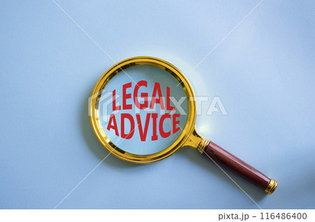 Legal advice symbol. Magnifying glass with words Legal advice. Beautiful blue background. Business and Legal advice concept. Copy space. Legal advice symbol. Magnifying glass with words Legal advice. Beautiful blue background. Business and Legal advice concept. Copy space. 116486400